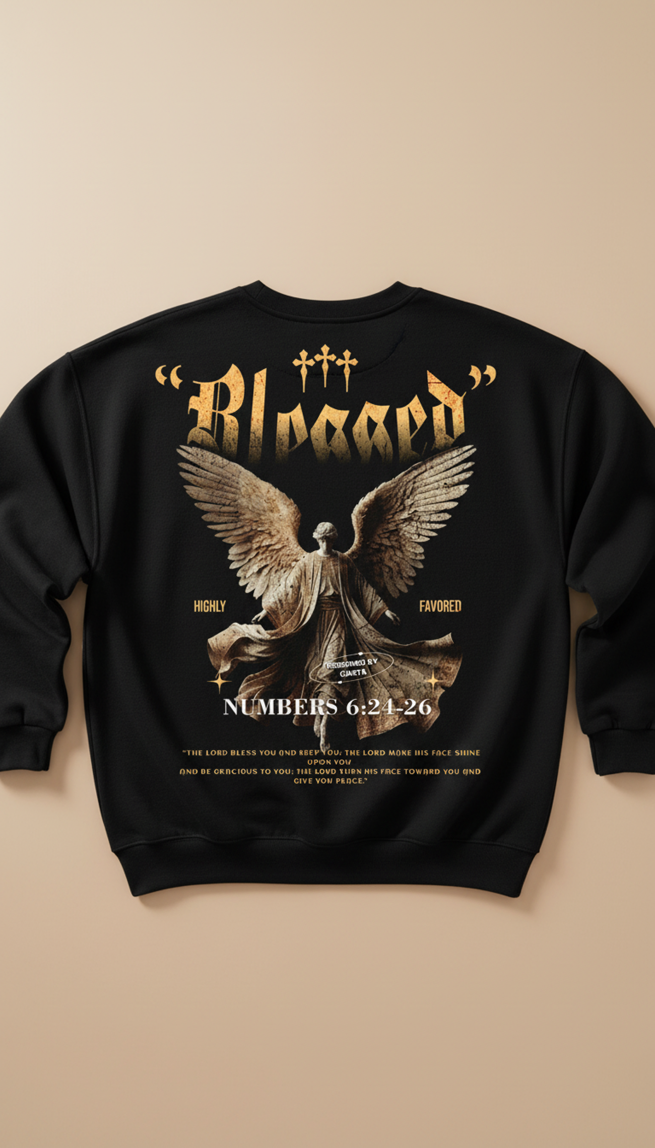 Black sweatshirt with angel graphic and text on a beige background