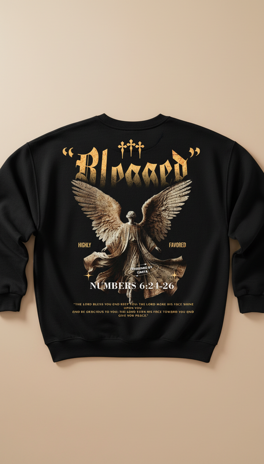 Black sweatshirt with angel graphic and text on a beige background